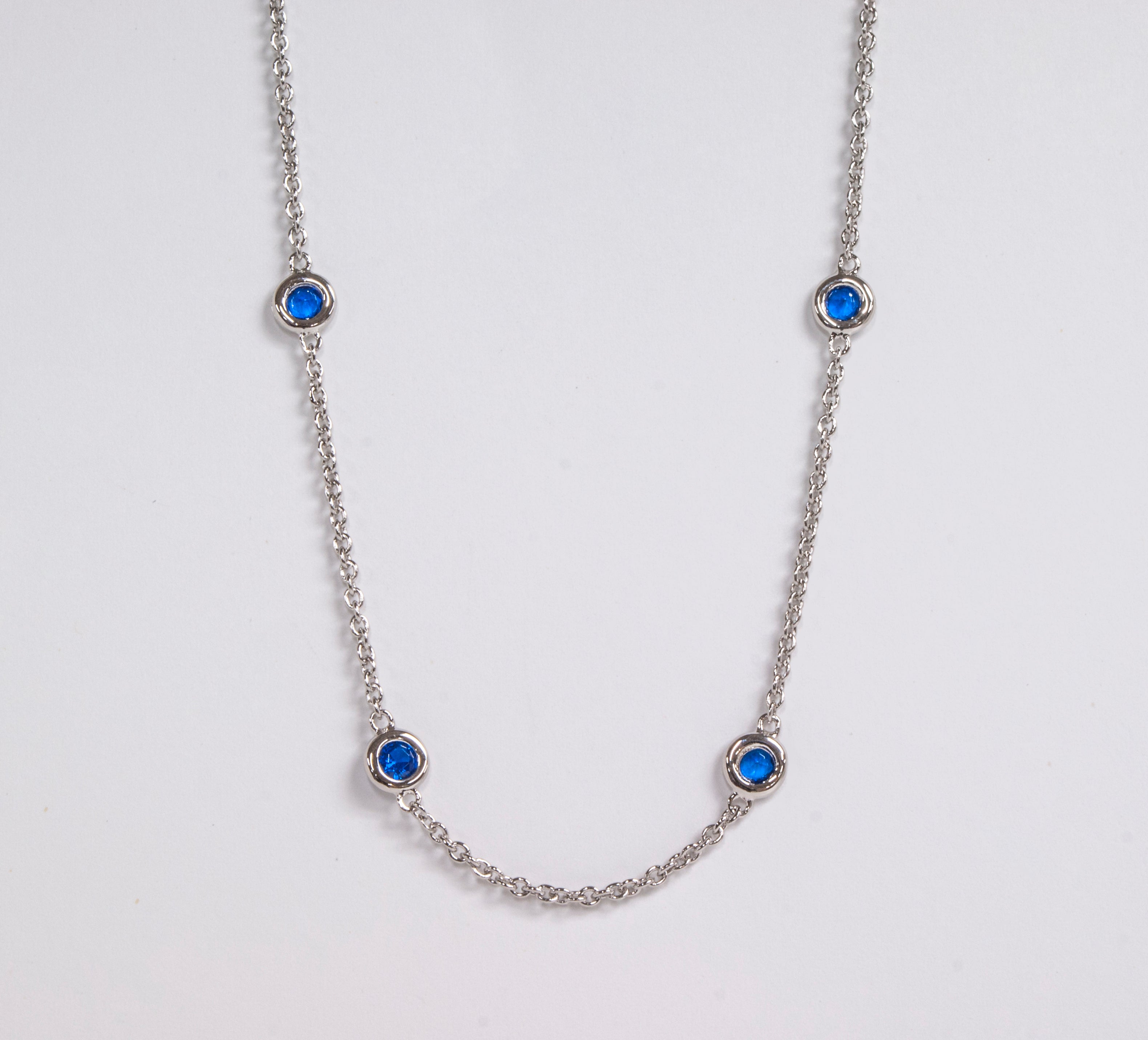 Sterling Silver Station Necklace with Synthetic Saphire by Miss Mimi