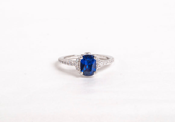Sterling Silver Ring with Cubic Zirconia and Emerald Cut Synthetic Sapphire by Miss Mimi